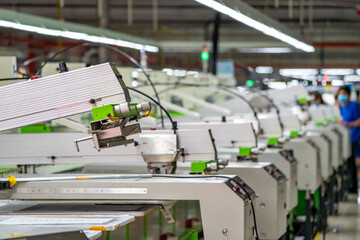 Printing area in textile factory in industrial zone in Ho Chi Minh City, Vietnam, with modern machinery and technology systems. - obrazy, fototapety, plakaty