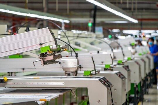 Printing area in textile factory in industrial zone in Ho Chi Minh City, Vietnam, with modern machinery and technology systems.