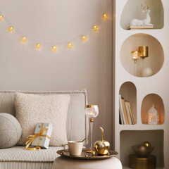 Amazing composition on white design shelf with christmas decoration, lights, gifts, lanterns ,deer,...