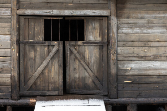 Closed gate of an old wooden house, rural architecture details