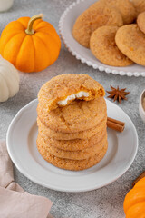 Pumpkin cinnamon cookies with cream cheese filling. Pumpkin snickerdoodle cookies. Food for Thanksgiving or Halloween.