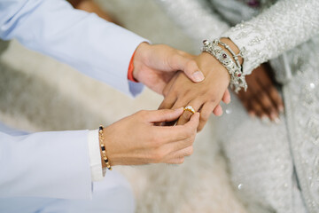 Bride and groom holding hands together. Wedding concept. Close up.thailand wedding ceramony
