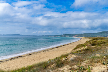 Fototapeta na wymiar View of the extensive beach of La Lanzada, A Lanzada, in O Grove and Sanxenxo, Pontevedra, Galicia.