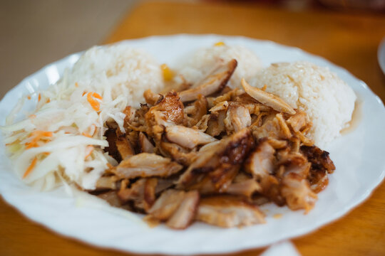 Traditional chicken meat shawarma plate with coleslaw salad and boiled rice