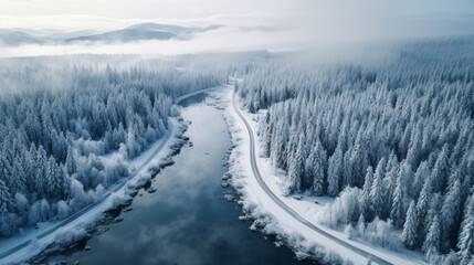 Aerial view of a winter roadway through a forest landscape