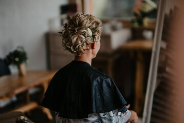 Young bride with elegant hairstyle, back view. Space for text
