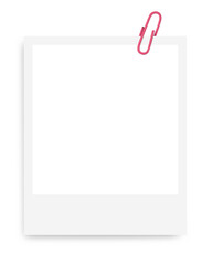 white Polaroid photo frame with a pink paper clip on a blank background.