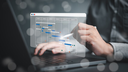 Project management or Engineering proceeding concept. Site manager working with Gantt chart schedule for plan tasks and progress. Planning software. Corporate strategy for construction and operations.