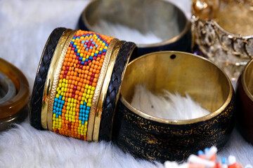 Indian bangles displayed in local shop in a market of Pune, India, These bangles are made of Gold,...