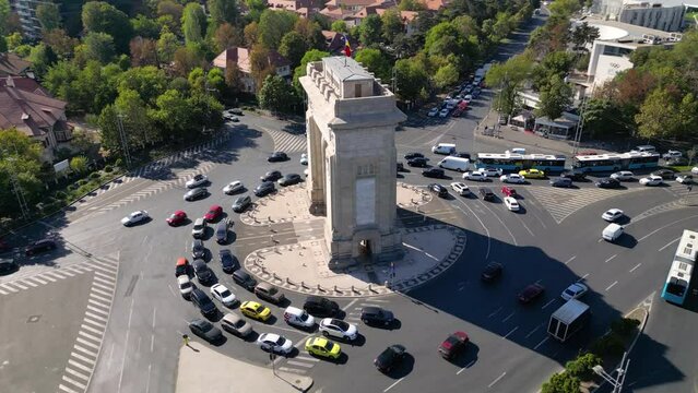 High Angle drone footage of the Arc de triumf in the capital of Romania - Bucharest.
