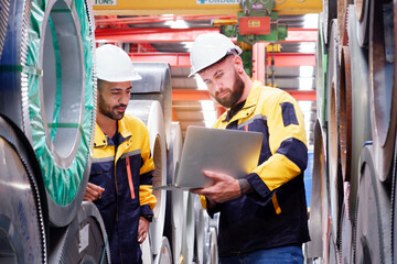 Engineer working to inspect production process in factory.