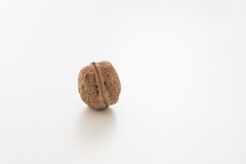Walnuts on a white table. Pure white background.
