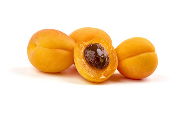 Isolated apricots. Fresh whole apricot fruit with half, isolated on white background.