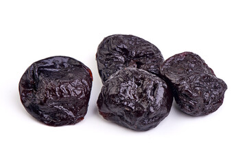 Prunes, dried fruits, close-up, isolated on white background.