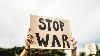 Stop war protest. Woman in crowd fighting against Israel and Palestine conflict