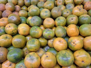 pile of Medan oranges or known as Citrus reticulata photographed at a high angle