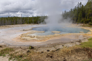 View of the Solitary Geyser in the Upper Geyser Basin near the observation point of Old Faithful in Yellowstone National Park