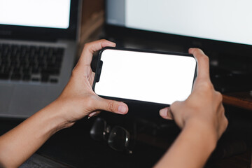 Mockup image of woman's hands holding black mobile phone with blank screen