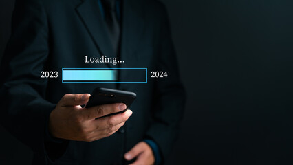 loading progress bar to 2024 Businessman using mobile phone investment and planning marketing finance and target growth success