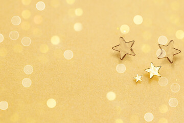 Gold Star on Glowing Blurred Background. Star Abstract Decoration Lights, Gold Sparkles and Blurred...