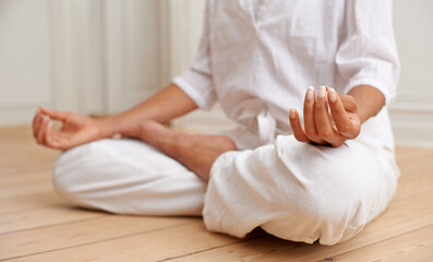 Zen, lotus and yoga, hands of woman on floor in gym for peace and mindfulness training. Relax,...