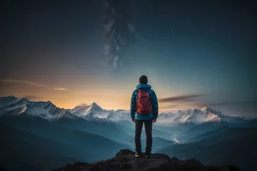 Foto op Plexiglas Back view of tourist standing on background of mountains and sky with glowing stars in night time. Nature landscape, Mountains, a man looking away into the mountains on a starry night © Sportvision