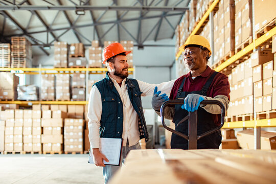 Warehouse Supervisor Discussing Work with an Employee