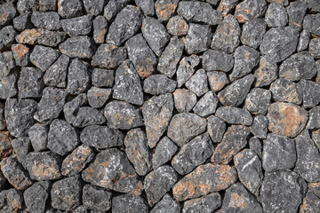 Flat lay photograph of a colorful stone wall. Stone background texture