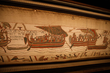 BAYEUX, FRANCE - AUGUST 25, 2022 Detail of the Bayeux Tapestry depicting the Norman invasion of...