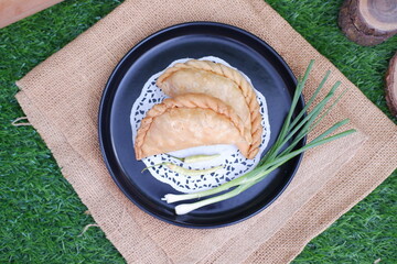 Curry puff (kari pap ) or Pastel Goreng is Pastry Popular in Indonesia.fried pastry with filling of...