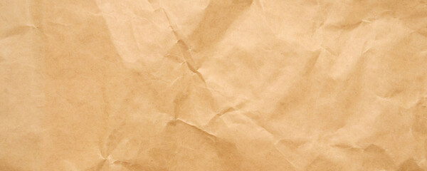 Abstract crumpled and creased recycle brown craft paper texture background