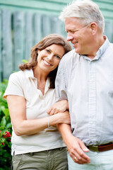 Senior couple, arm or love with support in marriage, care or wife smile on face in commitment family security. France, mature man or woman with gratitude, embrace or happy together in garden backyard