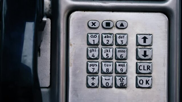 Payphone telephone booth dial digits in Britain 