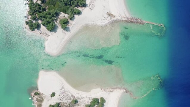 Aerial drone view of Port Glarokavos and lagoon beach in Kassandra penisula Chalkidiki Greece. Lagoon drone view blue sea Greece.