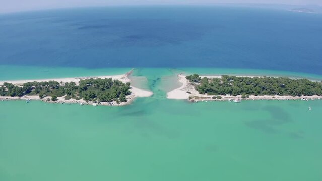 Aerial drone view of Port Glarokavos and lagoon beach in Kassandra penisula Chalkidiki Greece. Lagoon drone view blue sea Greece.