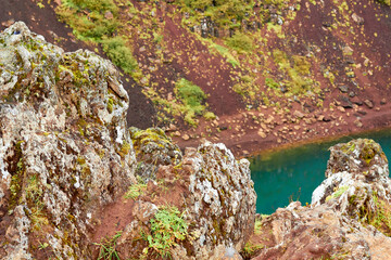Tranquil water flows over rocks in a serene natural environment.
