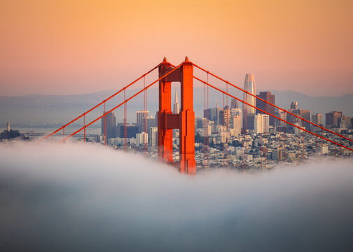 San Francisco Golden Gate Bridge Over Thick Fog at Sunset