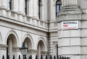 Whitehall sign on the wall of a government building at the entrance to Downing Street in Westminster, London SW1, UK.  © Nigel Harris