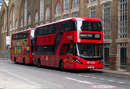 London, UK - March 15, 2023: Two red London buses at a bus stop outside Liverpool Street station, City of London, UK. 
