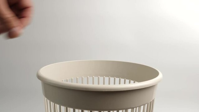 Plastic packaging from cosmetics is thrown into the trash for recycling or disposal.