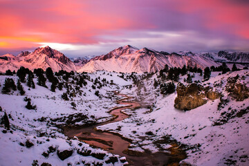 Mammoth Hot Spring Covered in Snow During Colorful Sunrise 