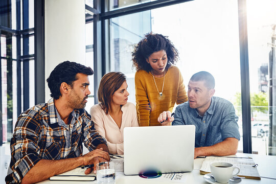 Laptop, app and teamwork with web designer in meeting, planning and working in development of online marketing. Website, design or group feedback for technology, strategy or creative problem solving