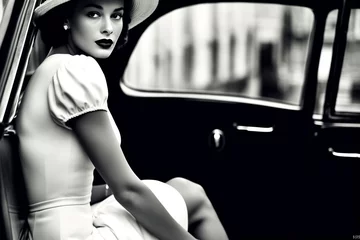 Poster Im Rahmen black and white photo of attractive female with vintage car 60's 70's style © Martin