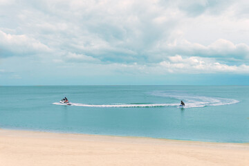 Jetski at the sea surface. Seascape with motorboat in bay. 