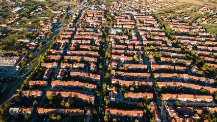 Aerial view of suburban houses in new modern development area. Thousands of houses aerial birds eye view suburb housing development new neighborhood in Europe modern architecture and design