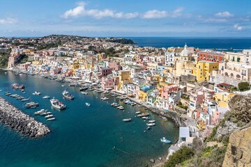 Fototapeta na wymiar Stunning coastline of the port of Corricella in Procida, famous for its vibrantly colorful housing