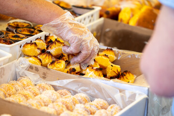 Delight in Portuguese confectionery at the bustling market. Explore delectable traditional treats