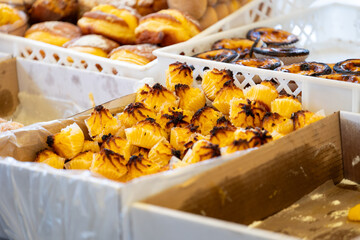Delight in Portuguese confectionery at the bustling market. Explore delectable traditional treats
