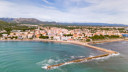 Fototapeta na wymiar Aerial drone photo of the coastal town and beach in L'Hospitalet de l'infant in Spain
