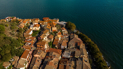 Aerial view of the sloping roofs of the houses in the historic center of Trevignano Romano, in the...